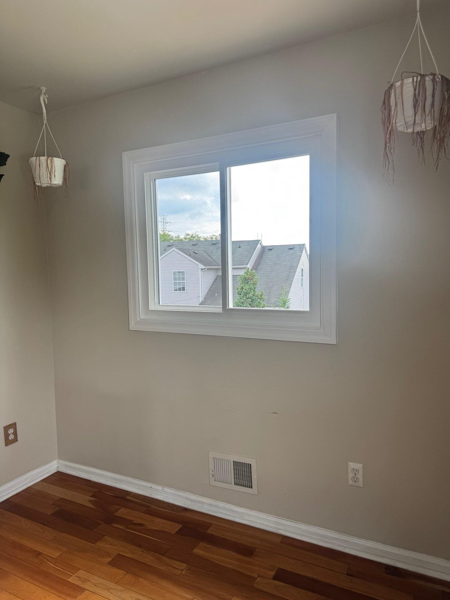 Windows completed project — New Jersey, Vinyl slider window with custom picture-frame interior trim